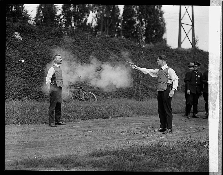 Demonstrator of bullet-proof vest, 1923, photo: Harris & Ewing Collection (Library of Congress)